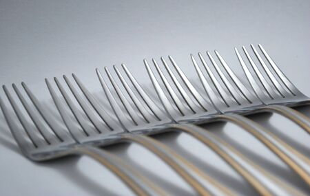 Metal forks, set in a rowの写真素材