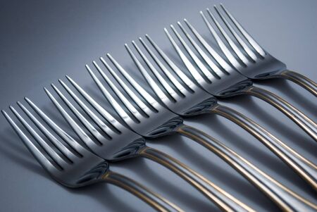 Metal forks, set in a rowの写真素材