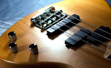 	Musical instrument, bass guitar, a wooden structure
