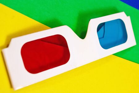 Stereo glasses for viewing anaglyph images on a colorful background.の写真素材