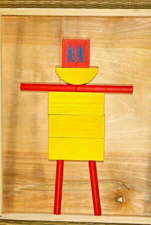 Colorful wooden man, assembled from parts children's designer toysの写真素材