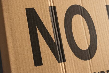 NO inscription in large letters on a cardboard box.の写真素材