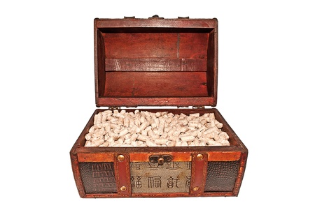 Small trunk full of pressed pellets. Isolated on white.の写真素材