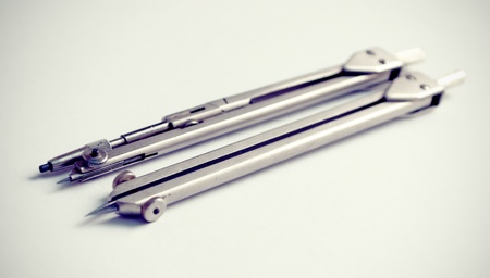 Drawing instruments compasses ready to use. Toned.の写真素材