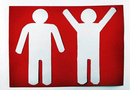 Two paper man on a red backgroundの写真素材