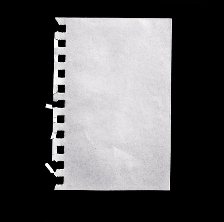 A sheet of paper isolated on black.の写真素材