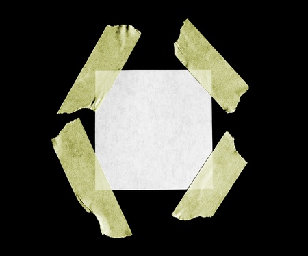 A sheet of paper isolated on black.の写真素材