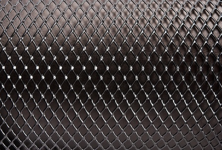 Metal grid on a black background.の写真素材