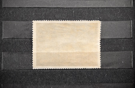 Empty blank of postage stamp in black album.の写真素材