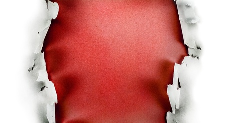 Breakthrough paper hole with red background, isolated on white.
