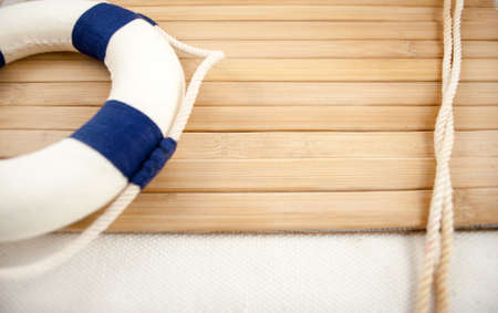 Few summer marine items on a wooden background 