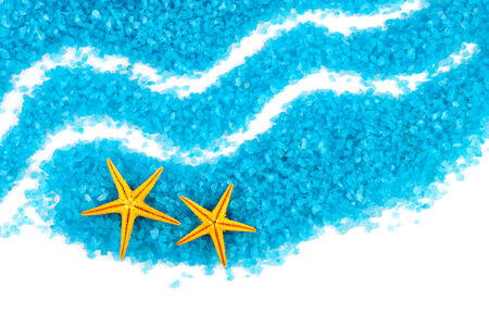 Yellow seastars and blue sea-salt waves on a white background の写真素材