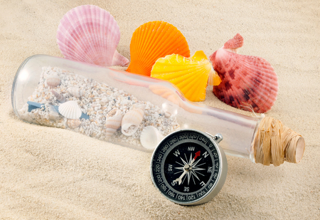 Few marine items on a sand in marine still life theme の写真素材