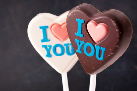 White & Brown chocolate hearts with \\\"I love you\\\" colorful inscription.の写真素材