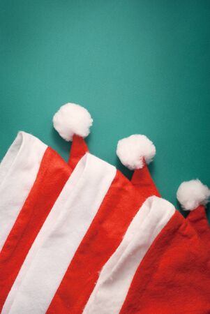 Beautiful Xmas composition of three Santa's hats.
