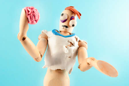 Classic wooden dummy infected by plasticine becomes zombie.の写真素材