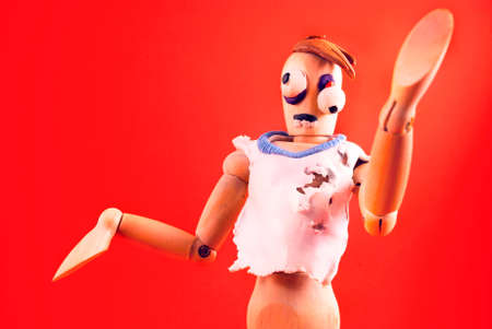 Classic wooden dummy infected by plasticine becomes zombie.の写真素材