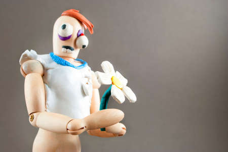 Classic wooden dummy infected by plasticine becomes zombie.の写真素材