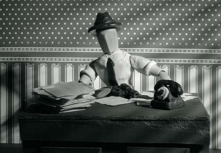 Classic wooden dummy in noir detective scene.の写真素材