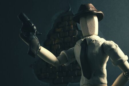 Classic wooden dummy in noir detective scene.の写真素材