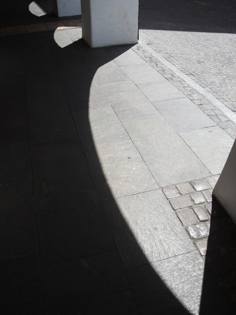Pavement with columns and shadowsの写真素材