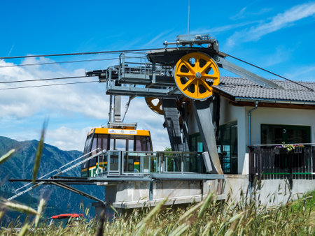 Taser, Italy - July 17, 2016: Side view of Taser cable car top station with parked gondola.のeditorial素材