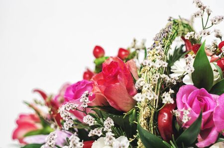 Flower composition with roses, carnations and red pepper on whiteの写真素材