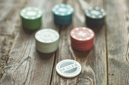 Close-up poker chips on wood table