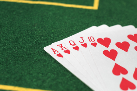 Five poker cards on green table. Win card set