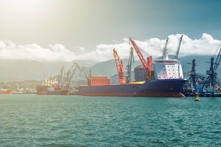 Container ship loading in trade port. Sea cargo conceptの写真素材