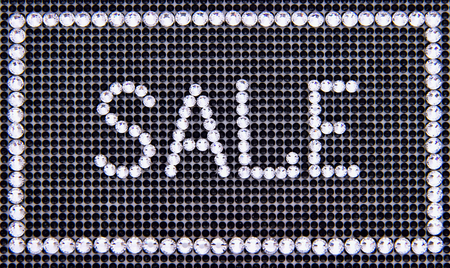 Word SALE is made rhinestones on a black canvas backgroundの写真素材