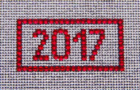 Year 2017 made by red rhinestones on a crystal canvas background