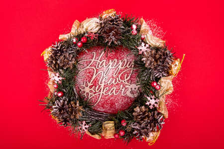 Christmas Wreath, Holiday Composition on a Red Background. Top Viewの写真素材