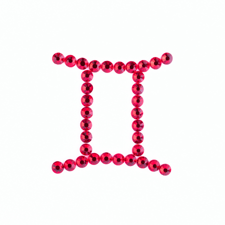 Gemini. Sign of the zodiac of red rhinestones on a white backgroundの写真素材