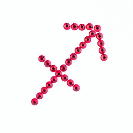Sagittarius. Sign of the zodiac of red rhinestones on a white backgroundの写真素材