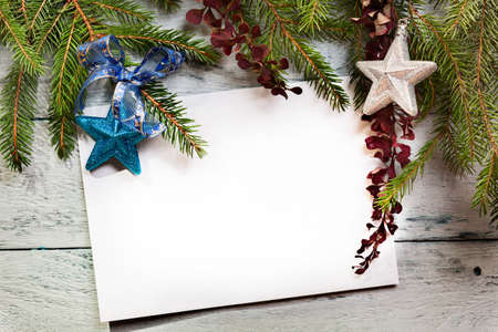 Christmas tree with decoration on a wooden boardの写真素材