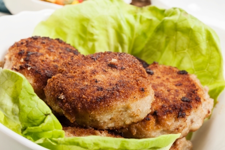 Meatballs and lettuce on plateの写真素材