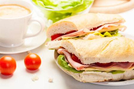 Italian panini sandwich with ham, cheese and tomatoの写真素材
