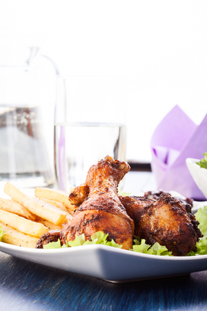 Chicken drumsticks with chips  Selective focusの写真素材