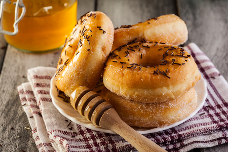 Morning breakfast with donuts and honeyの写真素材