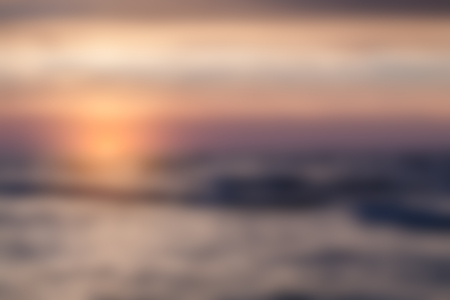 Blurry landscape with sunset on sea useful as backgroundの写真素材