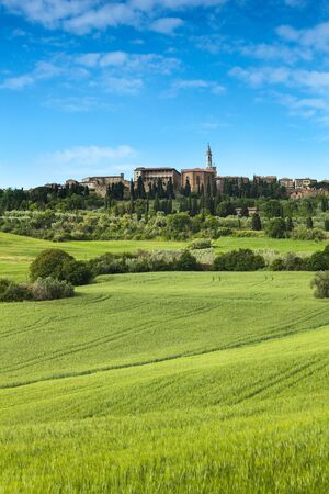 Spring landscape of fields Tuscany, in the background the town of Pienzaの写真素材