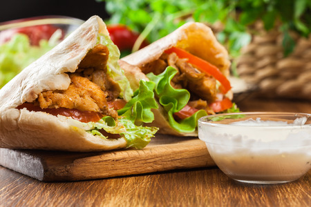 Doner kebab - fried chicken meat with vegetables in pita breadの写真素材