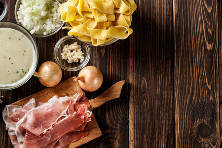 Ingredients ready for preparing pappardelle with prosciutto and cheese sauce. Food and drink. Top view.の写真素材