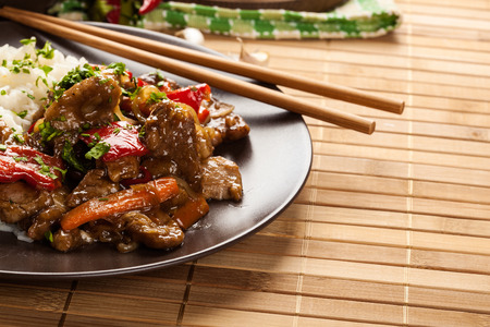Chinese sticky pork sirloin roasted with a sweet and savory sauce served with boiled riceの写真素材