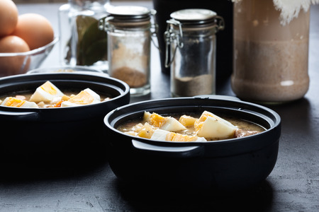 The sour soup made of rye flour with eggs on dishの写真素材
