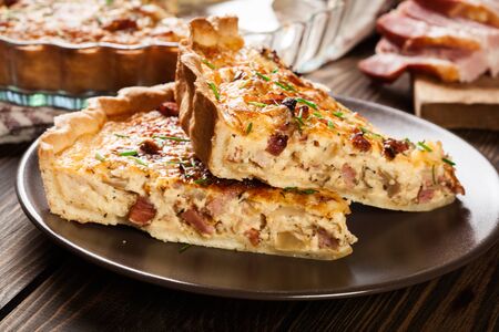Pieces of quiche lorraine with bacon and cheese. French cuisineの写真素材