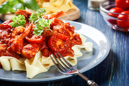 Pappardelle pasta with shrimp, tomatoes and herbs. Italian cuisineの写真素材