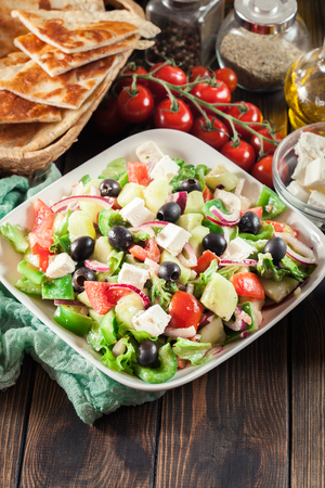 Greek salad with fresh vegetables, feta cheese and black olives. Top viewの写真素材