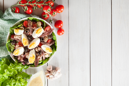 Nicoise Salad with tuna, anchovy, eggs and tomatoes. French dishの写真素材